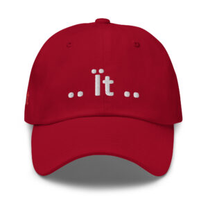 Red baseball cap with "dot it dot" embroidery.