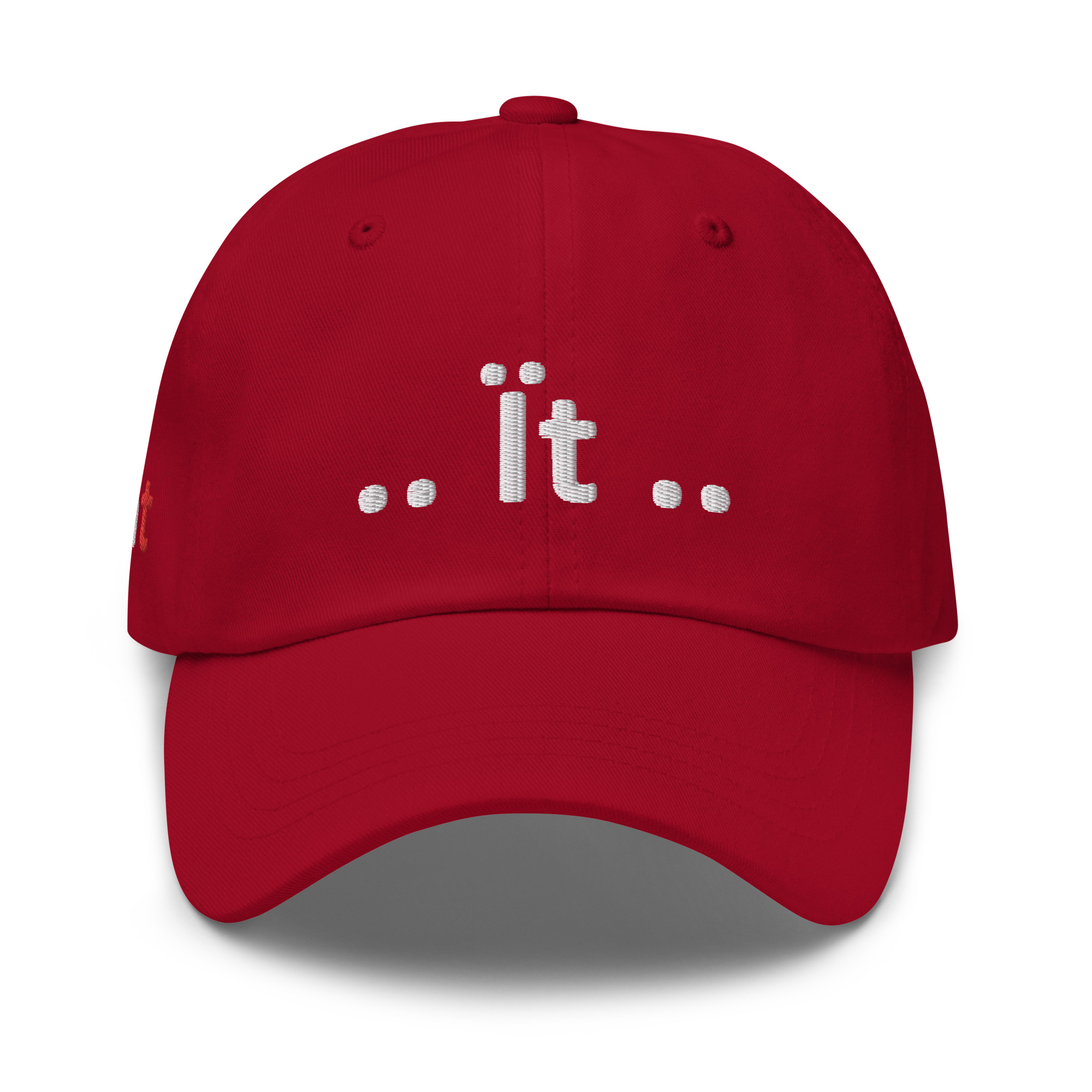 Red baseball cap with "dot it dot" embroidery.