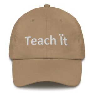 Beige cap with "Teach it" text.