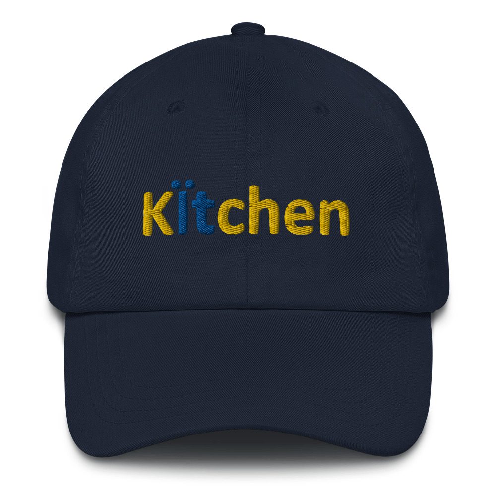 Navy cap with "Kitchen" embroidered in yellow.