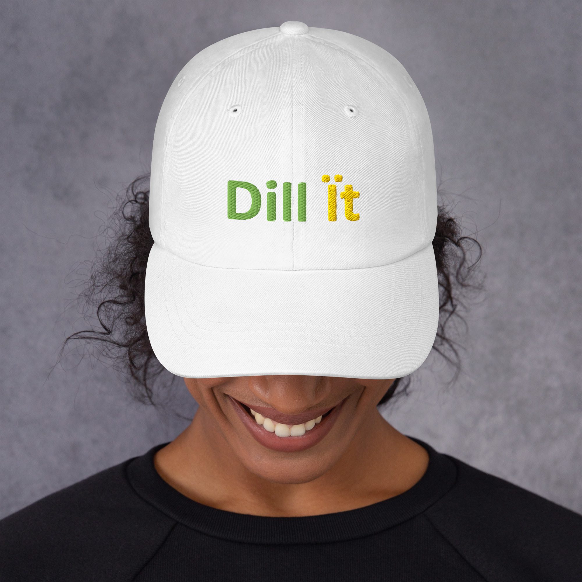 Person wearing white cap with "Dill it.
