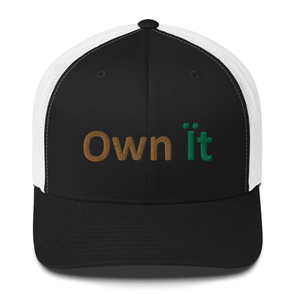 Black and white cap with "Own It".